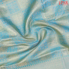 Light Turquoise Kanchipuram Silk Saree with checkered jacquard work, rich zari pallu, and blouse with Vazha Illai Stripes
