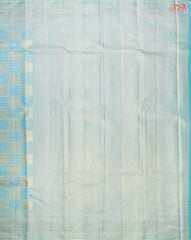 Light Turquoise Kanchipuram Silk Saree with checkered jacquard work, rich zari pallu, and blouse with Vazha Illai Stripes
