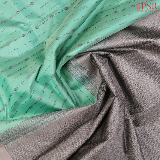 PSR Silks presents a Magic Mint colored Fancy Kanchipuram Silk saree with combination of Ecru Grey color.