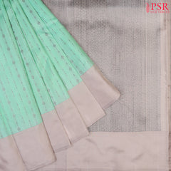 PSR Silks presents a Magic Mint colored Fancy Kanchipuram Silk saree with combination of Ecru Grey color.