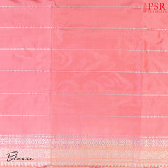 Discover the timeless charm of our Melon Peach Banarasi Katan Silk Saree, paired gracefully with a soothing Light Pink combination.