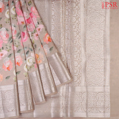 Mink Grey Chiniya Silk Saree with vibrant floral prints and silver zari paisley motifs.