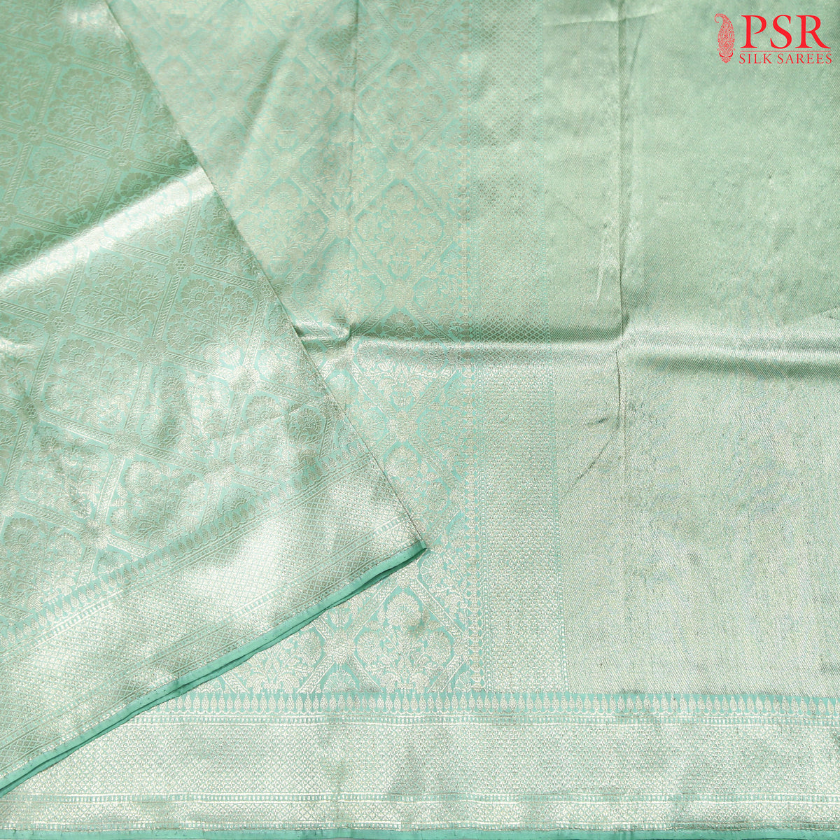 Experience elegance with PSR Silks' enchanting Mint Green pure Banarasi saree, featuring exquisite zari jacquard work.
