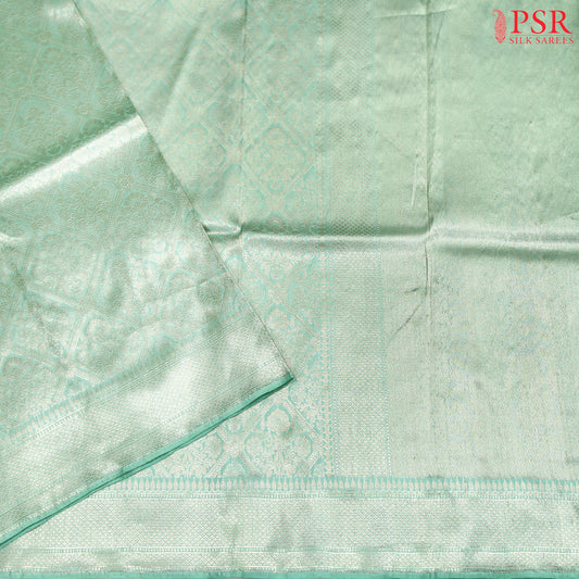Experience elegance with PSR Silks' enchanting Mint Green pure Banarasi saree, featuring exquisite zari jacquard work.