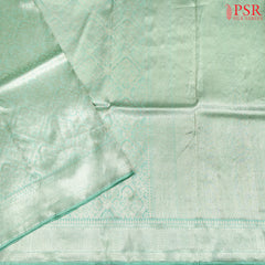 Experience elegance with PSR Silks' enchanting Mint Green pure Banarasi saree, featuring exquisite zari jacquard work.