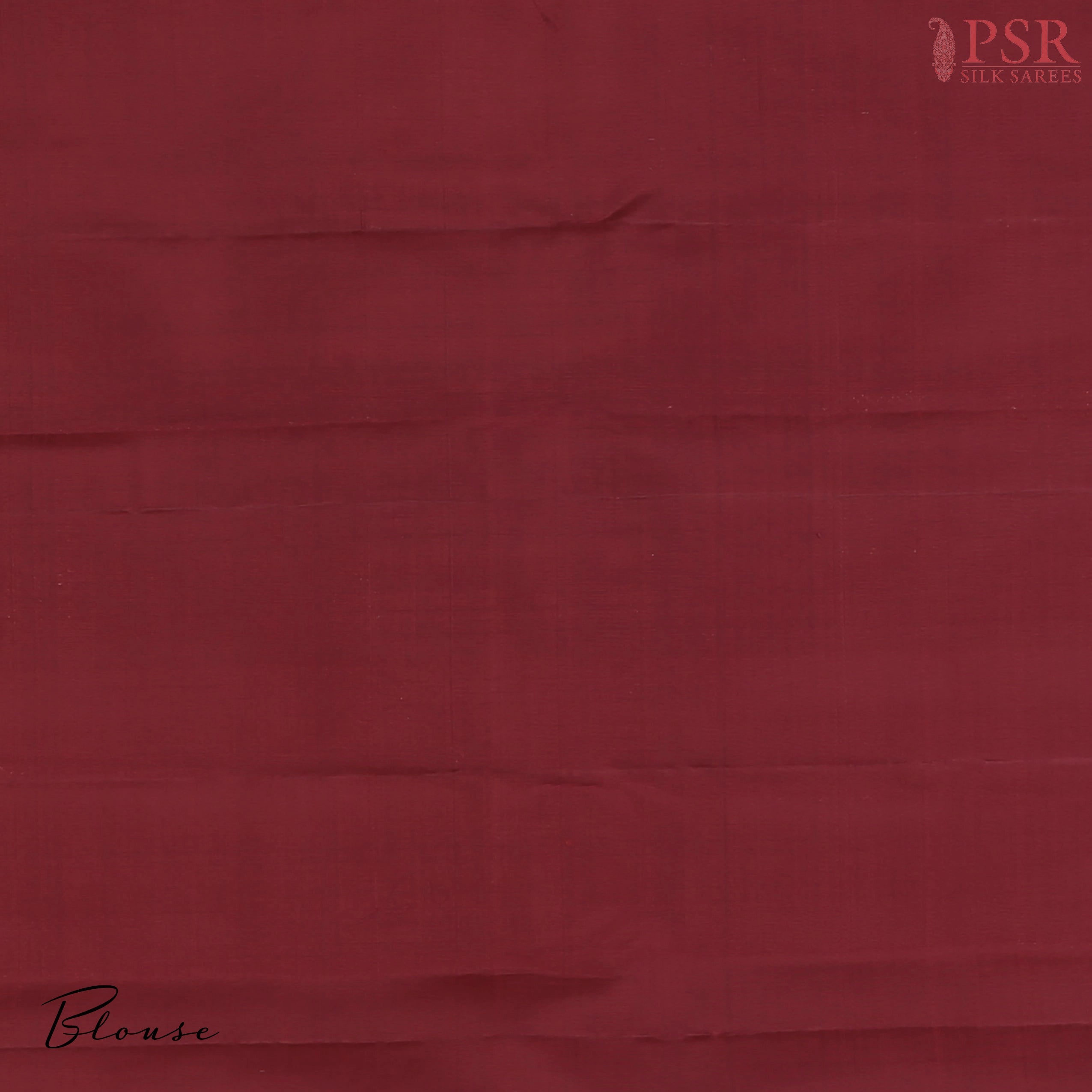 Plain Maroon silk blouse complementing the saree’s grandeur