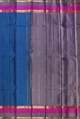 PSR Silks presents a Peacock Blue colored Arani Silk saree with combination of Grey color.