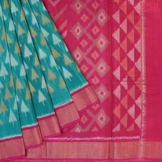 Persian Green Patola Pochampally Silk Cotton Saree featuring Ikkat patterns, a contrasting Magenta Pink Pochampally motif pallu, tissue border, and a plain blouse