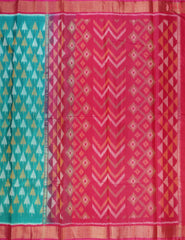 Persian Green Patola Pochampally Silk Cotton Saree featuring Ikkat patterns, a contrasting Magenta Pink Pochampally motif pallu, tissue border, and a plain blouse