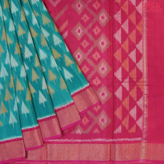 Persian Green Patola Pochampally Silk Cotton Saree featuring Ikkat patterns, a contrasting Magenta Pink Pochampally motif pallu, tissue border, and a plain blouse