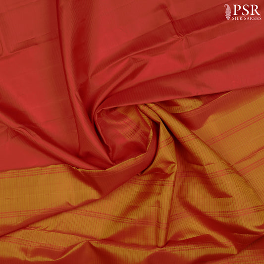 PSR Silks presents a Red colored Arani Silk saree with combination of Dark Orange color.