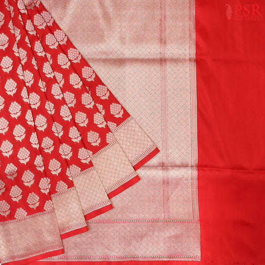 PSR Silks proudly presents an exquisite Banarasi Silk saree in a captivating shade of red.