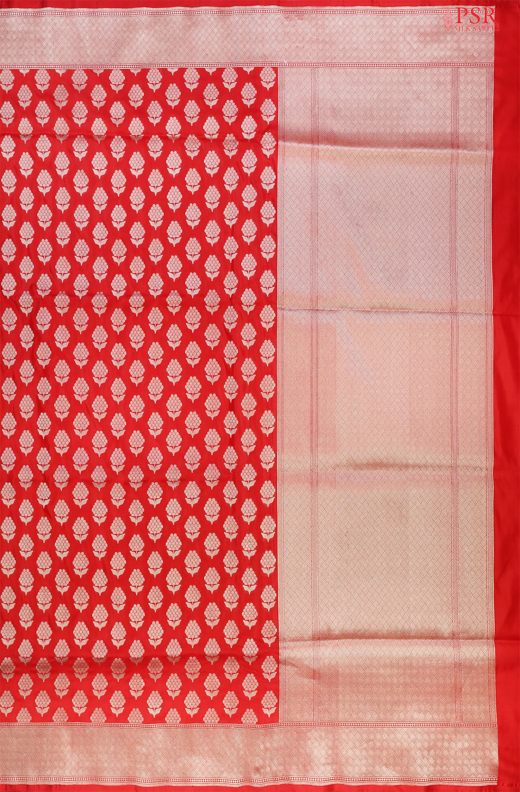PSR Silks proudly presents an exquisite Banarasi Silk saree in a captivating shade of red.