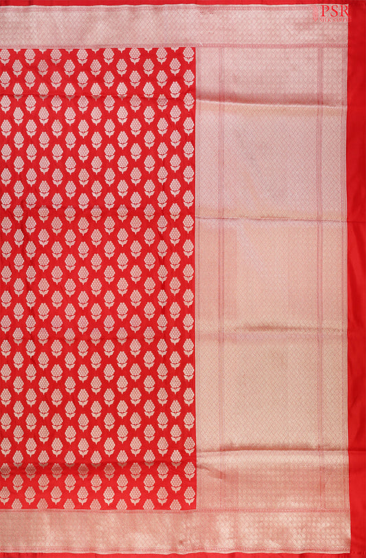 PSR Silks proudly presents an exquisite Banarasi Silk saree in a captivating shade of red.