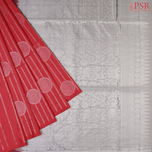 Celebrate elegance with our enchanting Red Soft Silk Saree, beautifully complemented by a sophisticated Grey hue