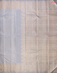 Grand silver zari-rich pallu with artistic detailing