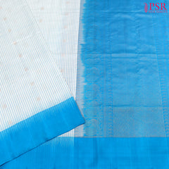 Experience elegance and grace with the exquisite White and Cerulean Blue Coimbatore Soft Silk Saree by PSR Silks. 