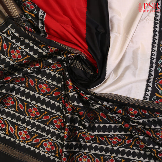 PSR Silks presents a stunning Tricolor pure Pochampally Ikkat Silk Saree, beautifully blending the shades of Floral White, Black, and Red. 