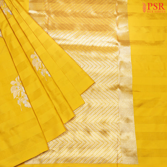 Unveil the magic of elegance with our Yellow Banarasi Silk Saree from PSR Silks. 