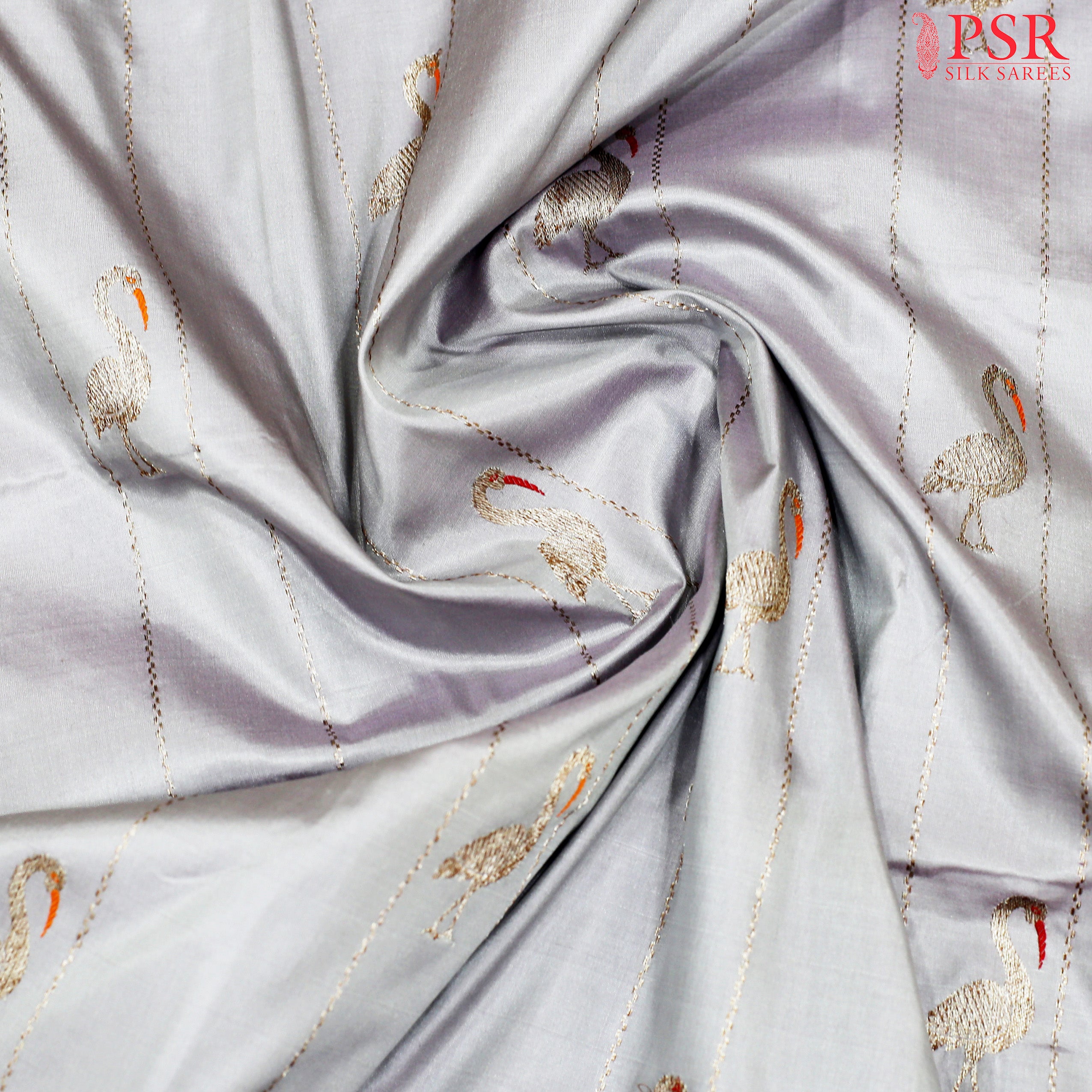 The Banaras silk has a Zari Strips With Flamingo Motifs