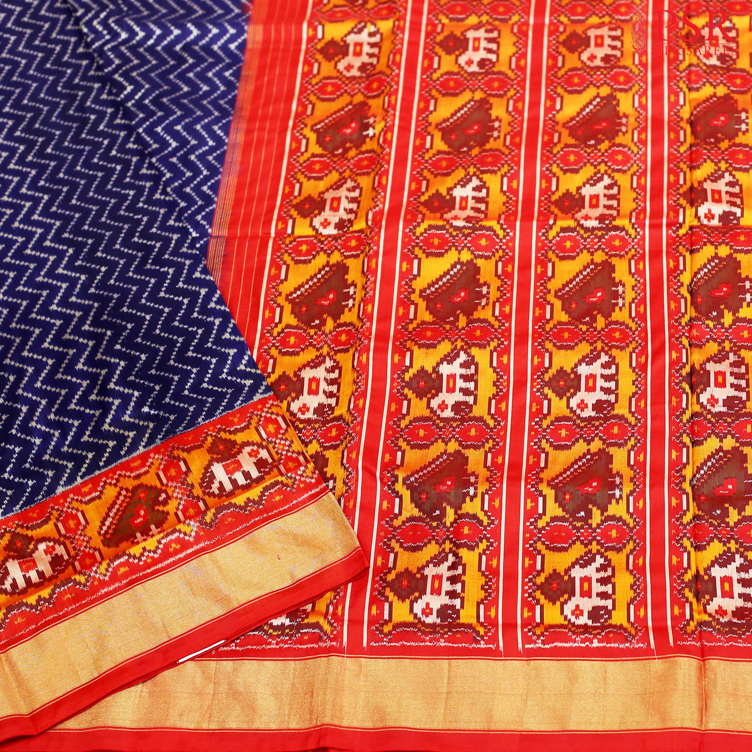 PSR Silks Presents Midnight Violet Colored Pochampally Silk Saree With Combination Of Red Color.